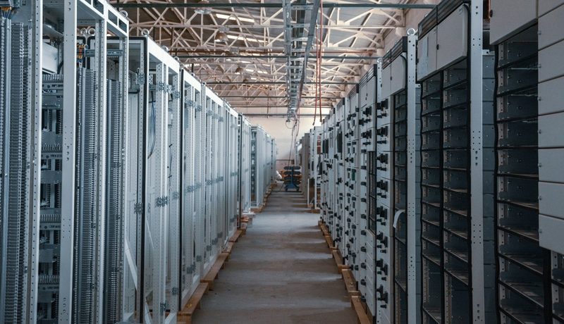 Aisle of server racks inside a data center